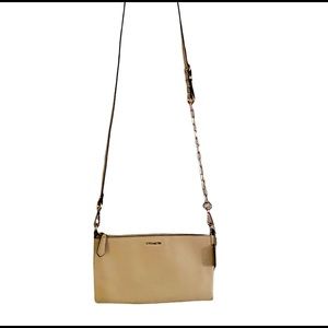 Coach tan crossbody with gold hardware, good condition.